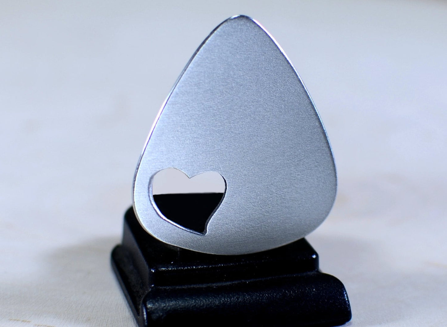 Love Guitar Pick with Cutout Heart in various metals