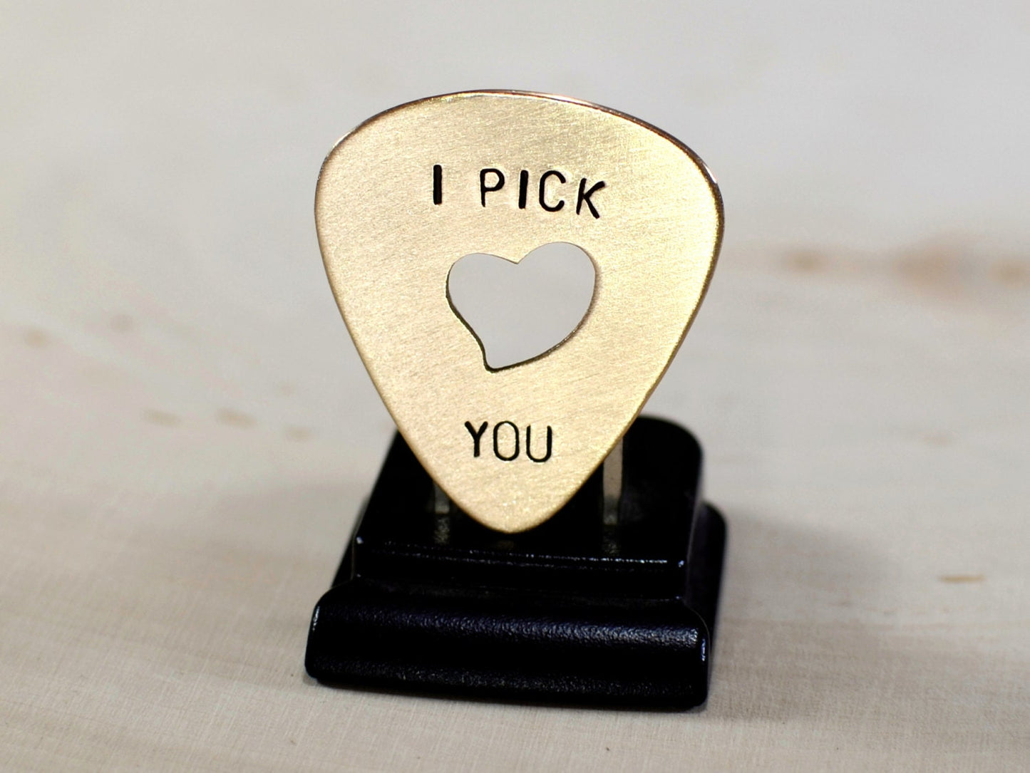 Heart in bronze guitar pick and I pick you