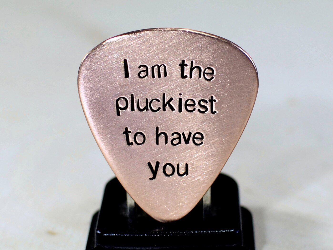 Copper guitar pick with I am the pluckiest to have you