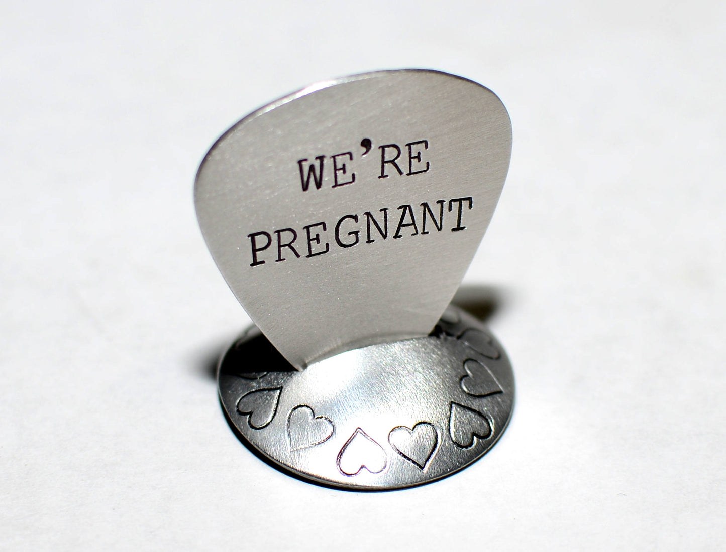 We’re Pregnant Guitar Pick for a Rocking Surprise in your choice of metals