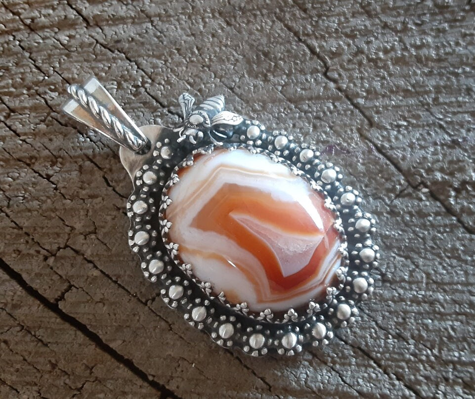 Red lace agate pendant with flowers and bee