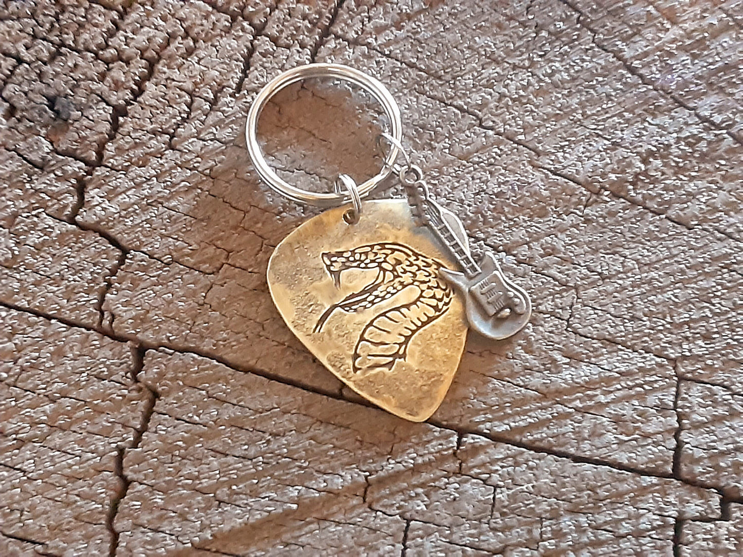 Snake design on brass guitar pick key chain and a small accent guitar charm