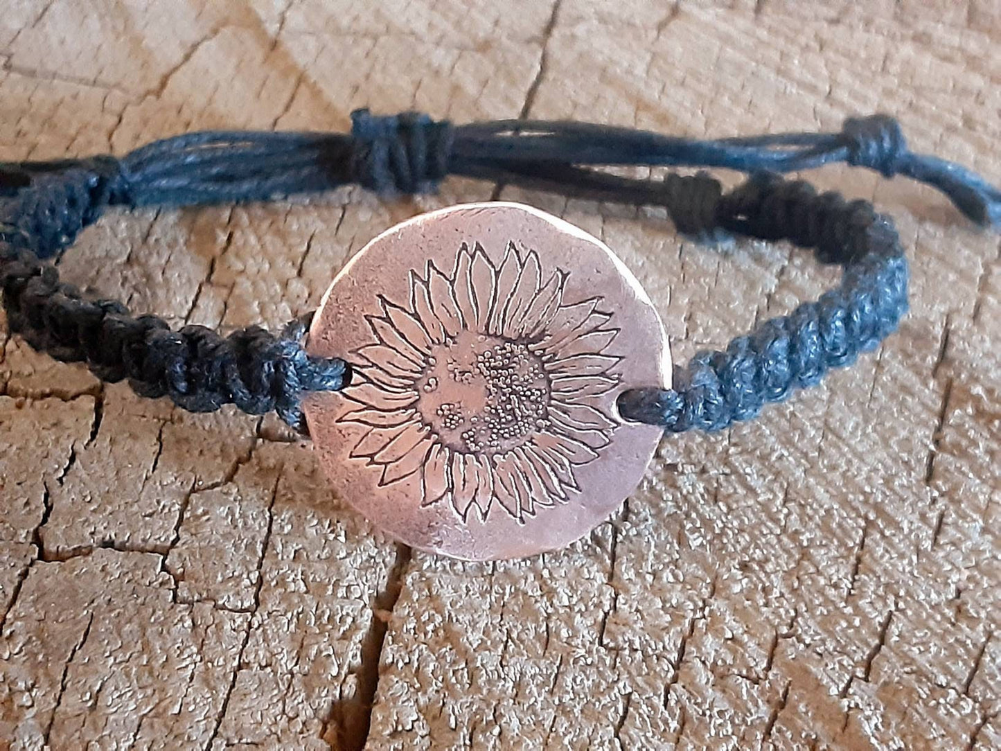 Sunflower button bracelet in black hemp with copper tag