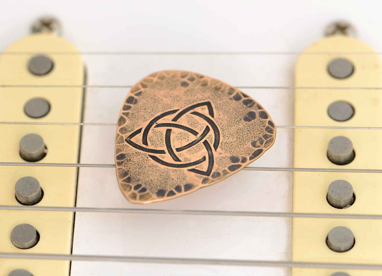 Trifecta Bronze Guitar Pick in a Celtic Trinity Knot