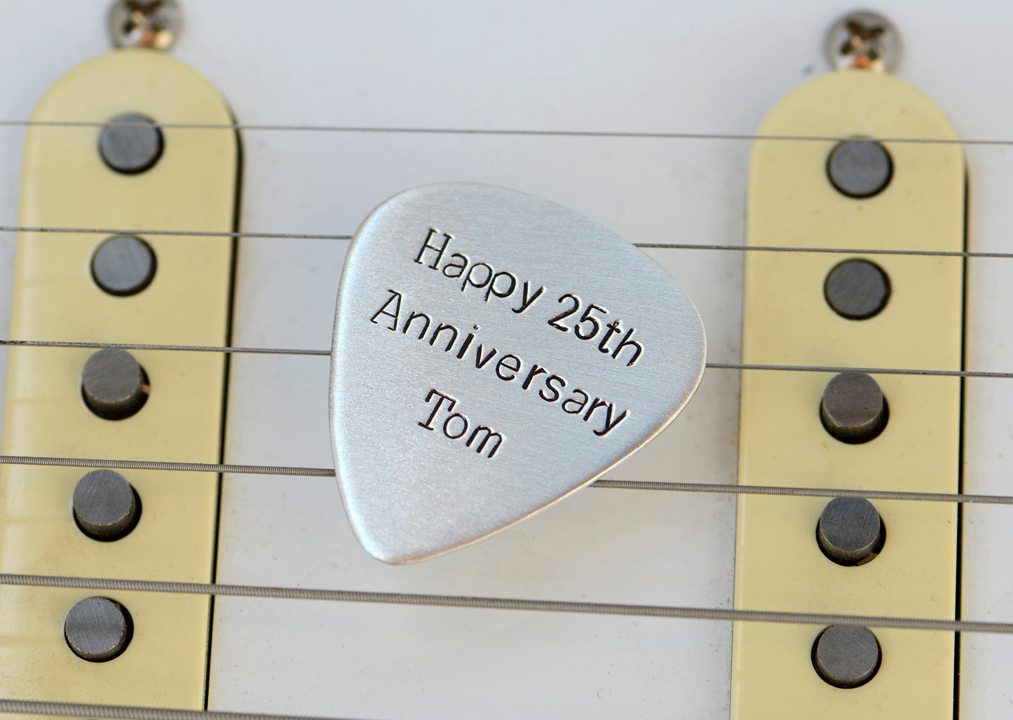 Guitar Pick in sterling silver to Celebrate 25th Silver Anniversary