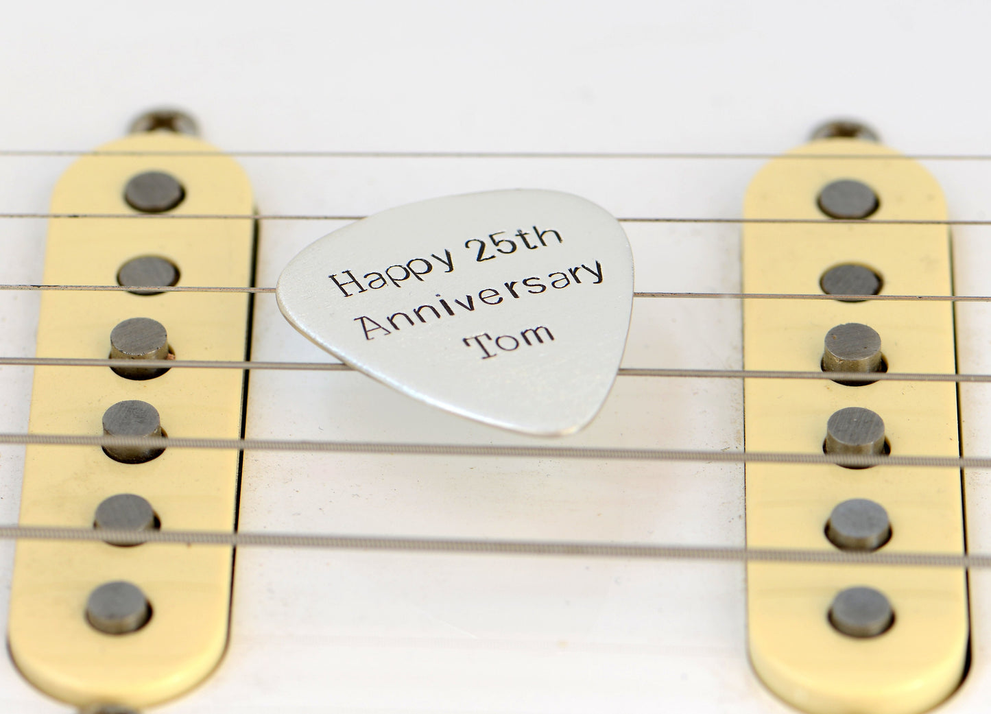 Guitar Pick in sterling silver to Celebrate 25th Silver Anniversary