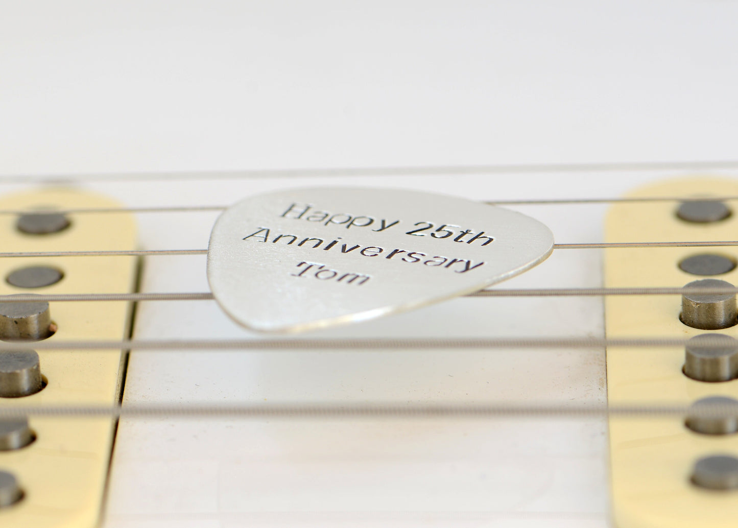 Guitar Pick in sterling silver to Celebrate 25th Silver Anniversary