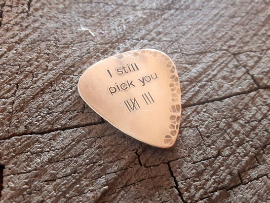 Playable guitar pick in bronze with tally marks for 8th anniversaries