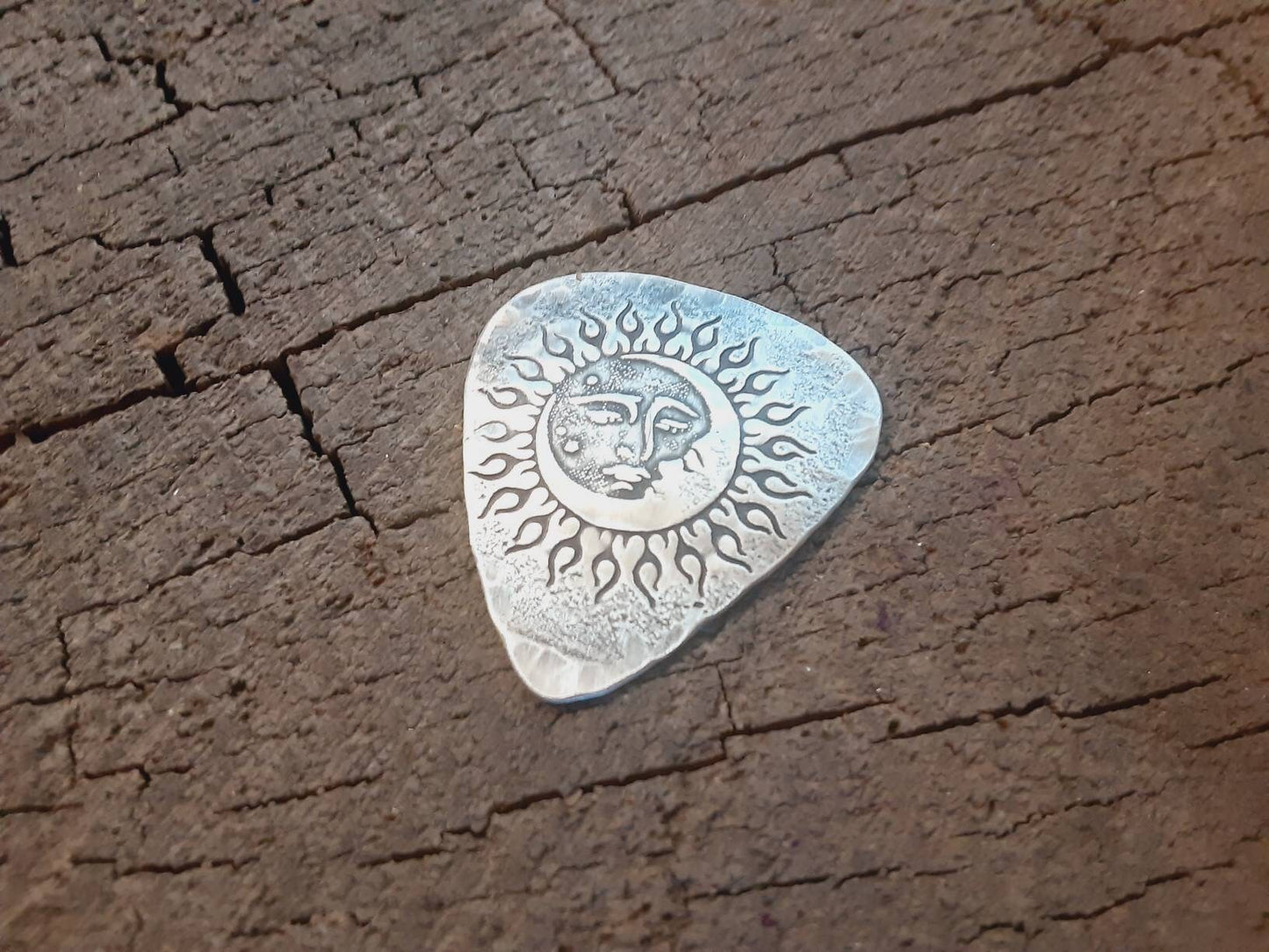 Sterling silver guitar pick with sun moon and stars