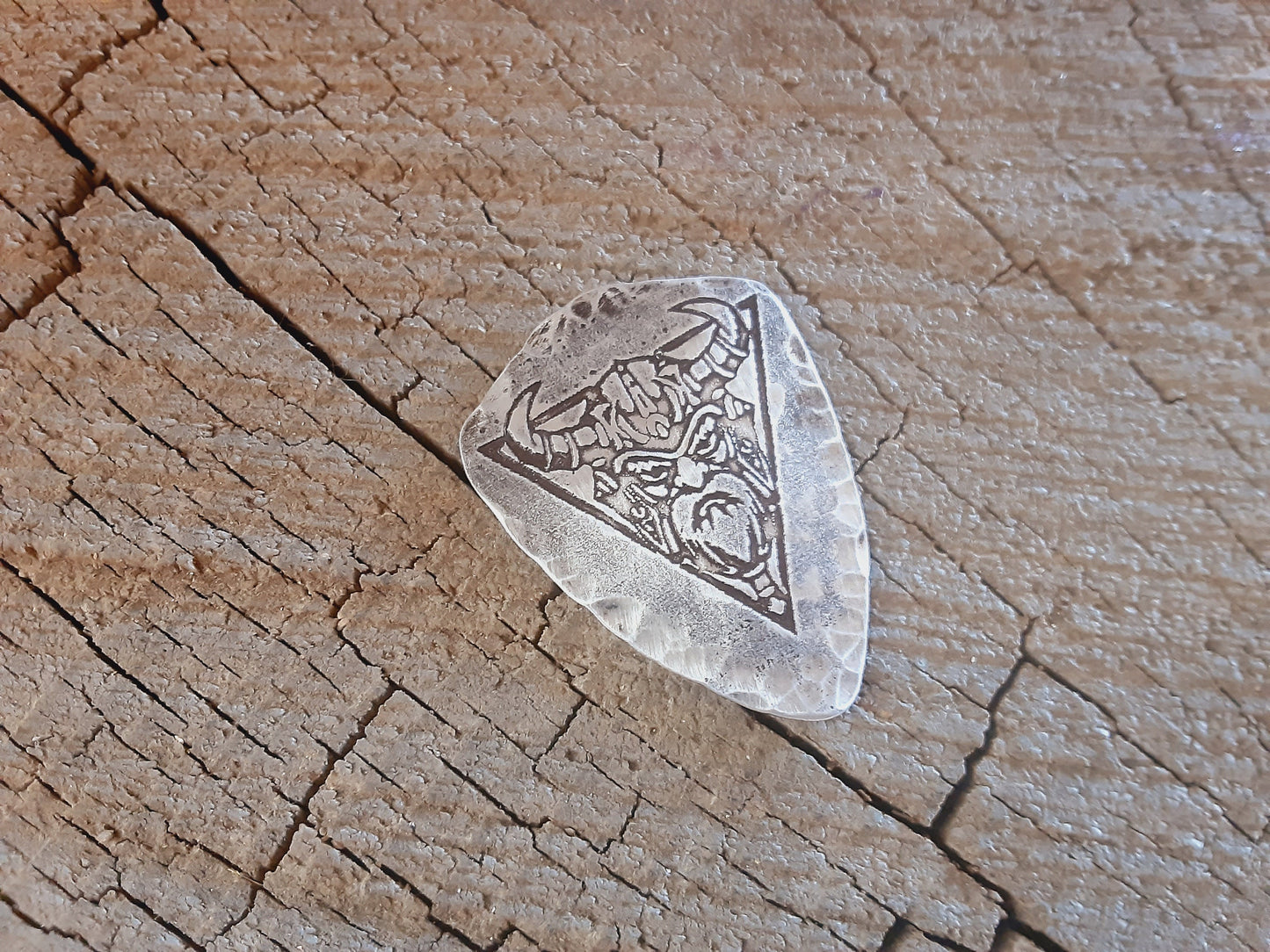 Shield shaped sterling silver guitar pick with viking theme