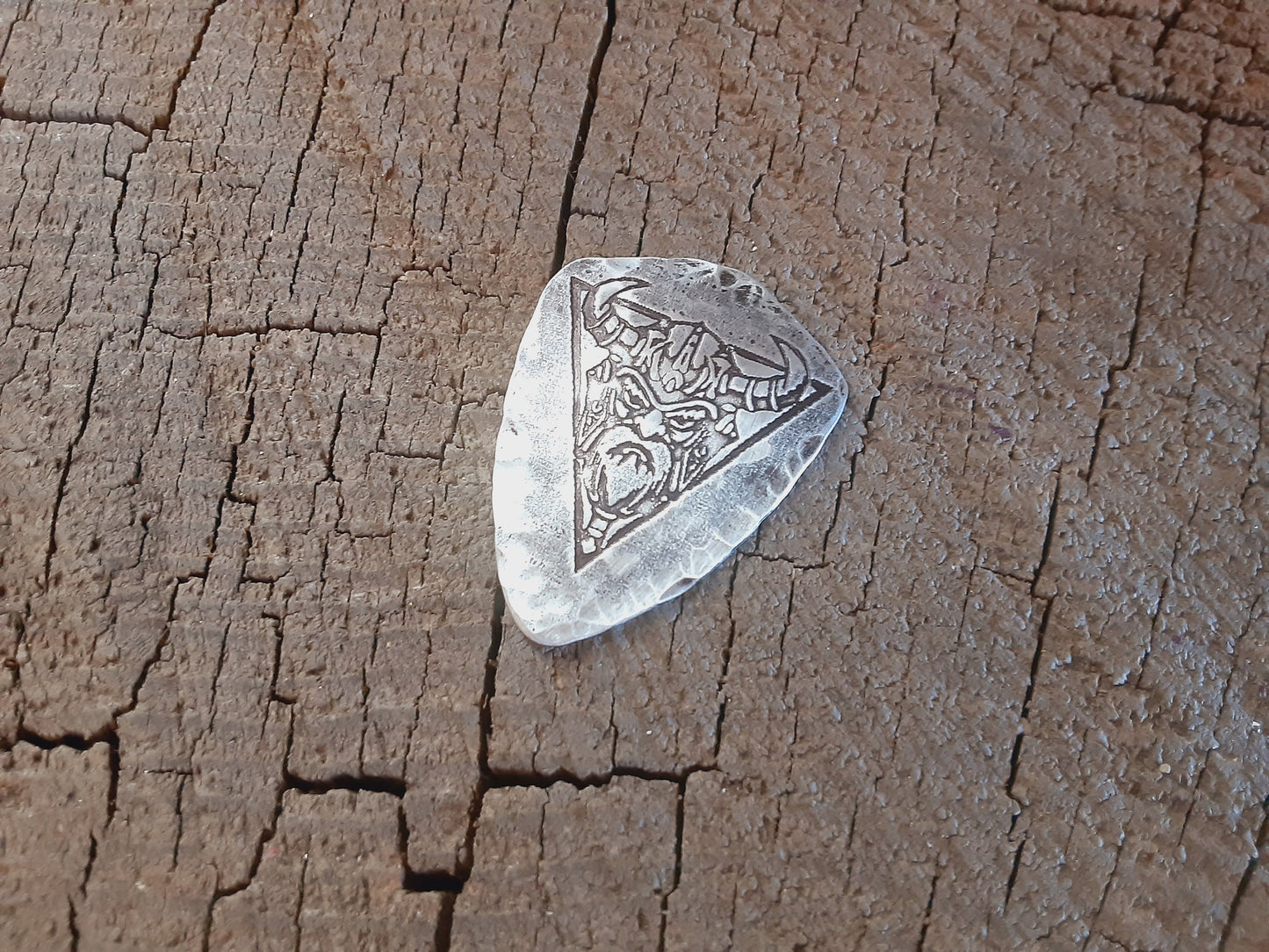 Shield shaped sterling silver guitar pick with viking theme