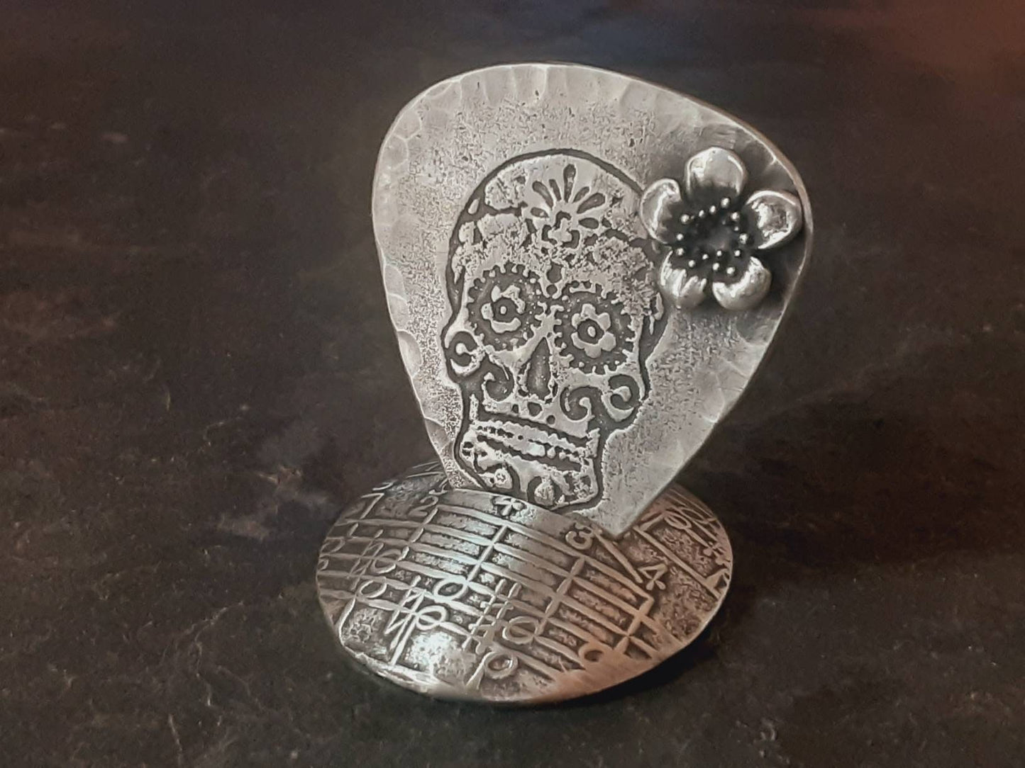 Sterling silver guitar pick with sugar skull and 3D flower along with a with guitar pick holder stand combination