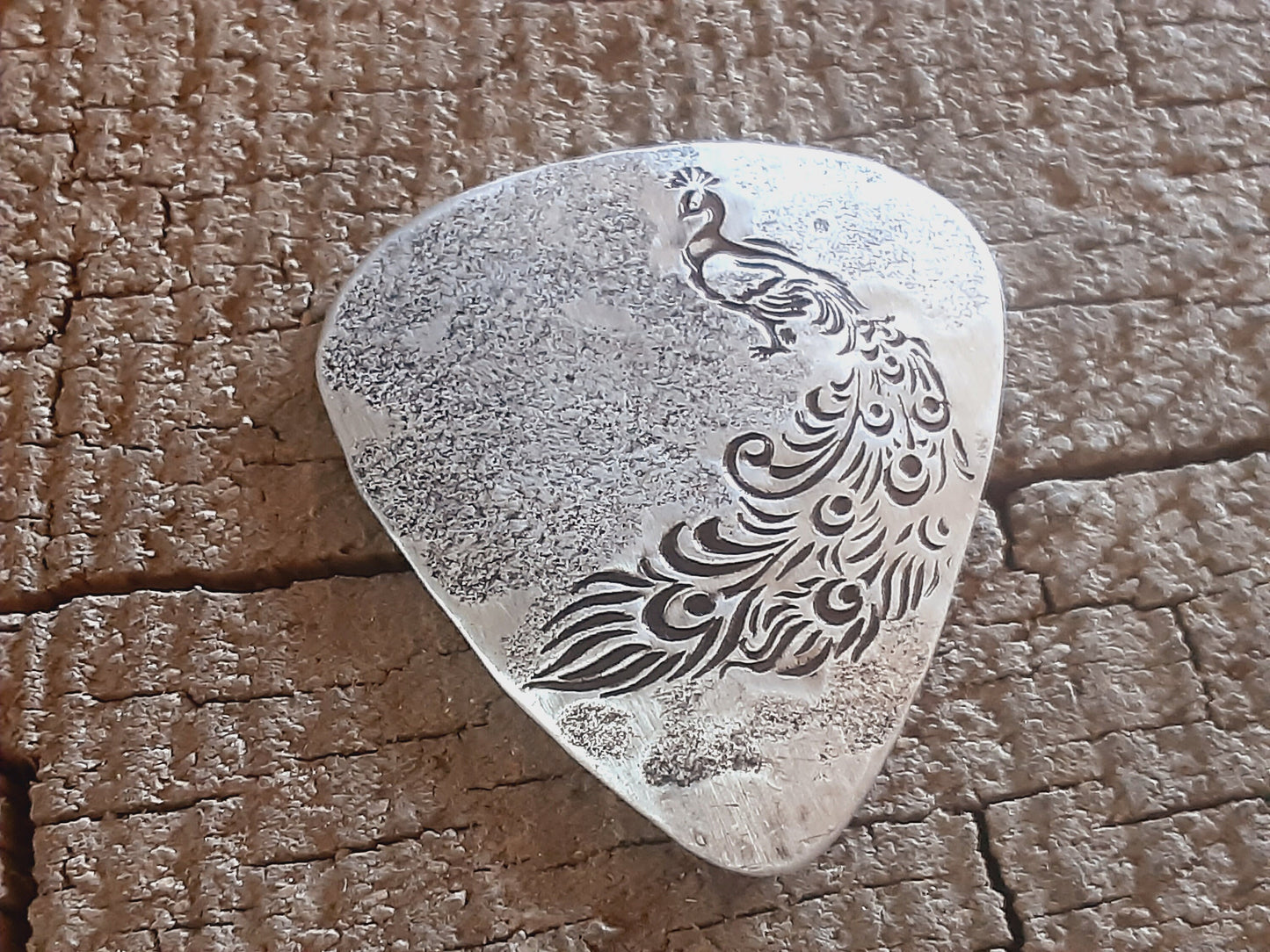 Sterling silver guitar pick with peacock