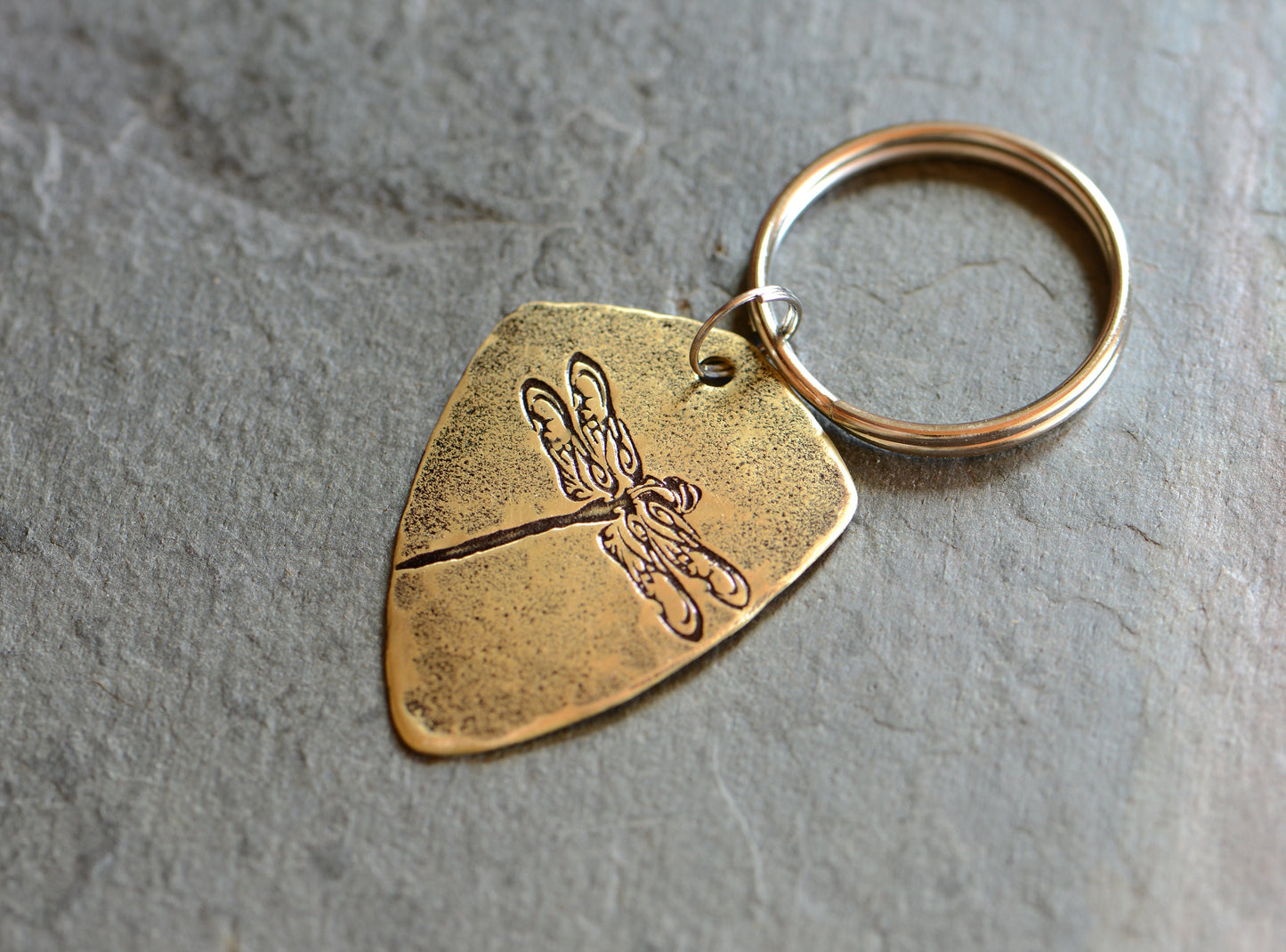 Brass dragonfly key chain in shield shape