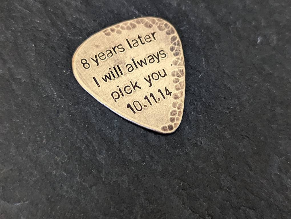 Bronze guitar pick custom engraving