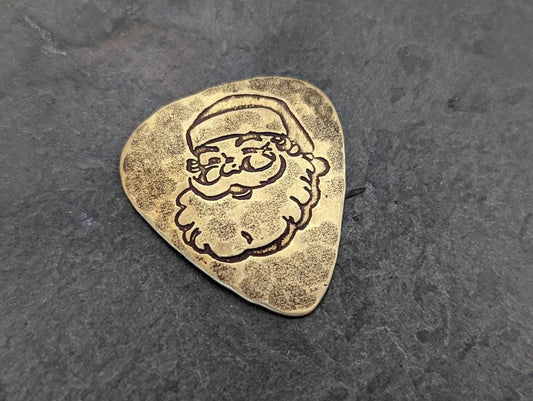 Santa Claus guitar pick in brass