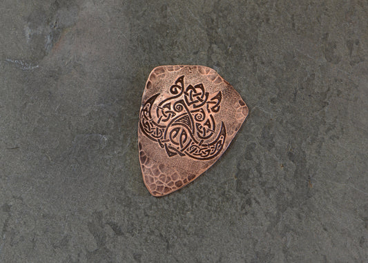 Celtic boar on copper guitar pick