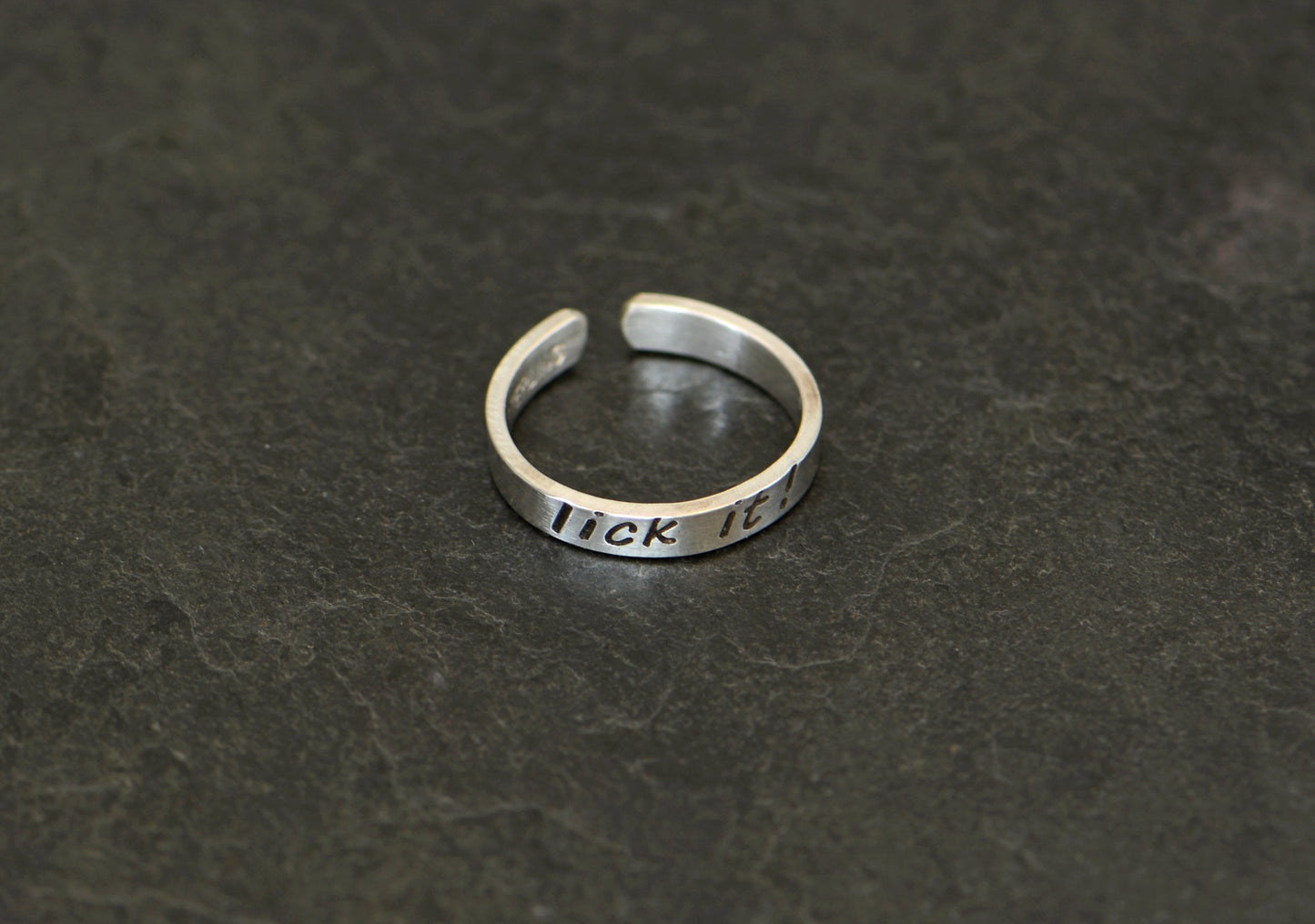 Sterling silver toe ring stamped with lick it