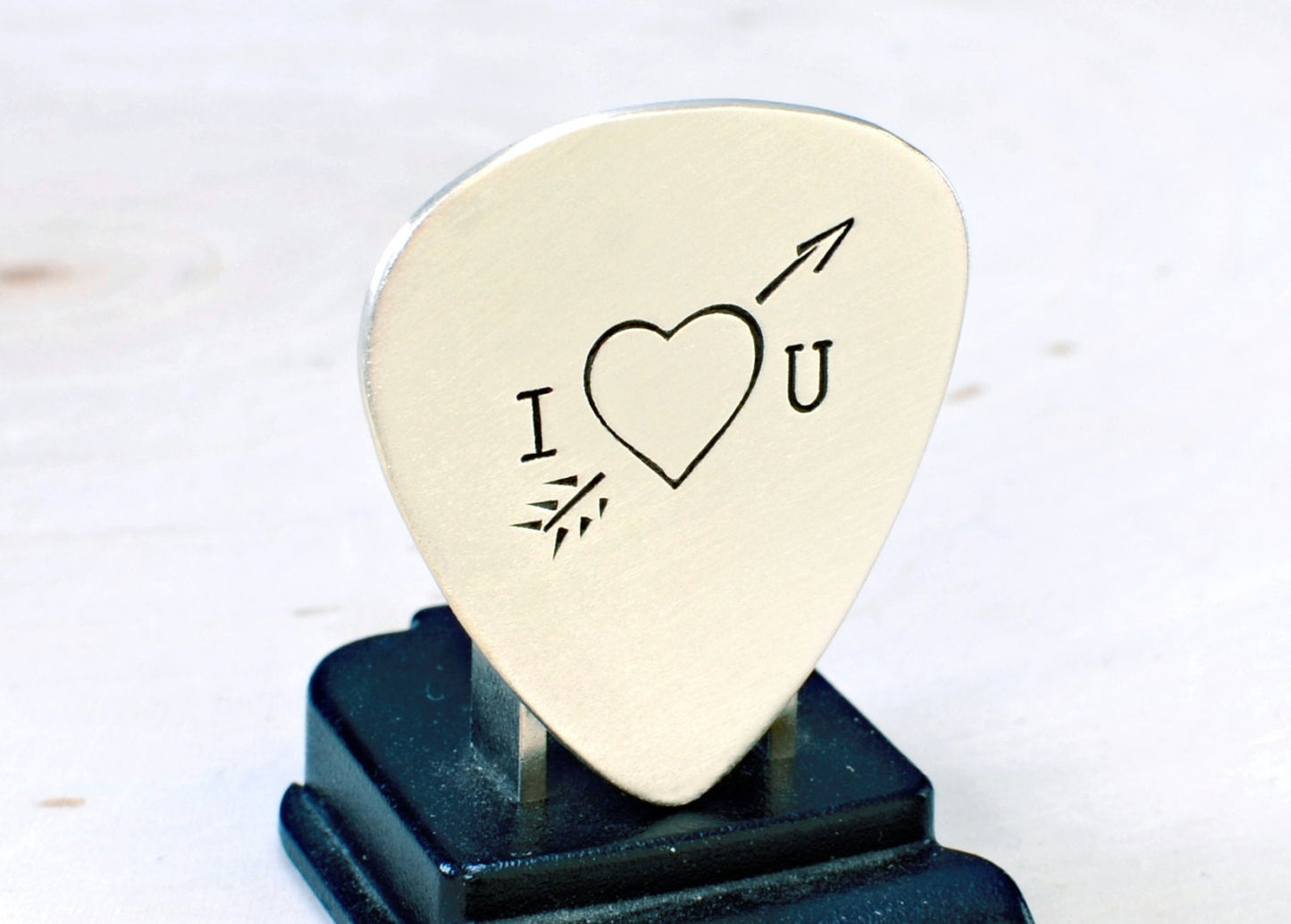 Heart and arrow theme on sterling silver guitar pick